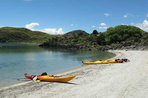 The Mission - kayaks on beach in Wanaka